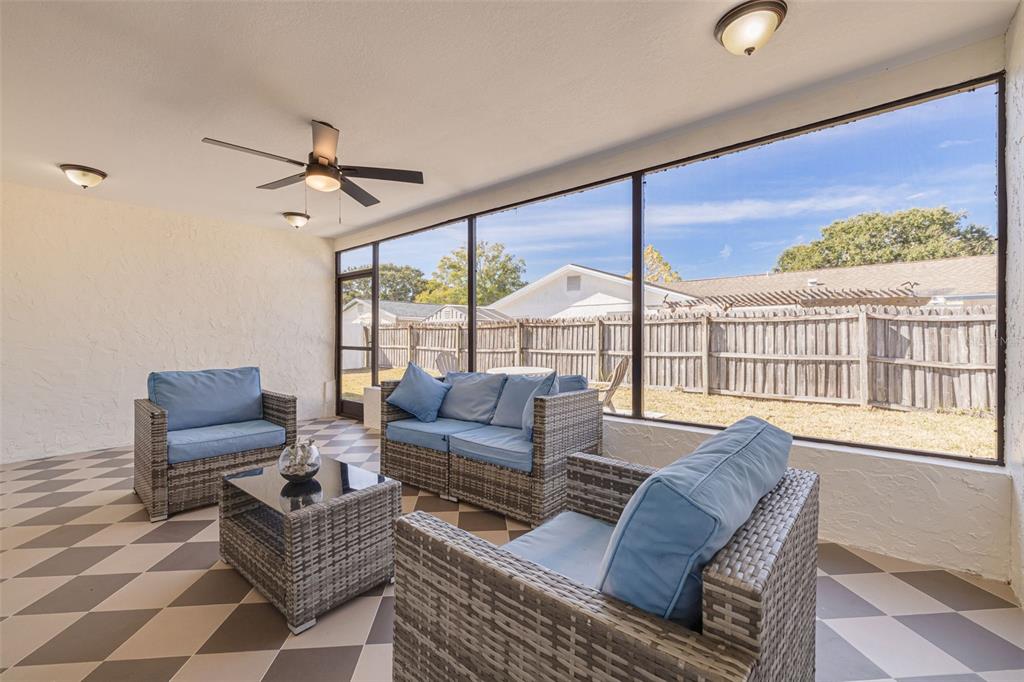2034 58th Way North Clearwater, FL 33760 - Photo 17 of 35 a living room with furniture and a floor to ceiling window