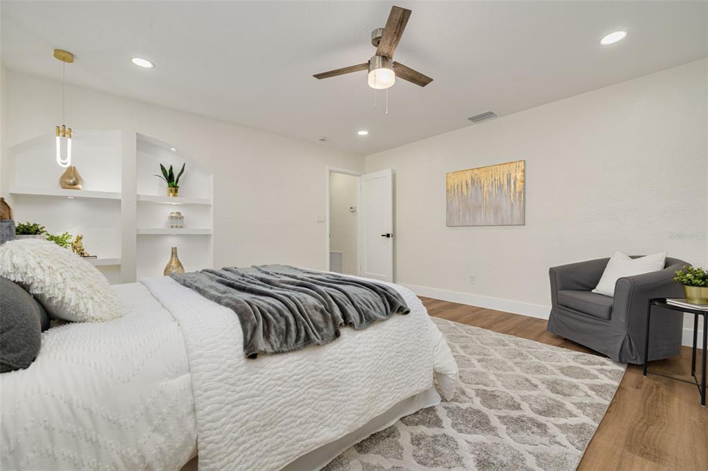 2034 58th Way North Clearwater, FL 33760 - Photo 19 of 35 a bedroom with bed and a couch