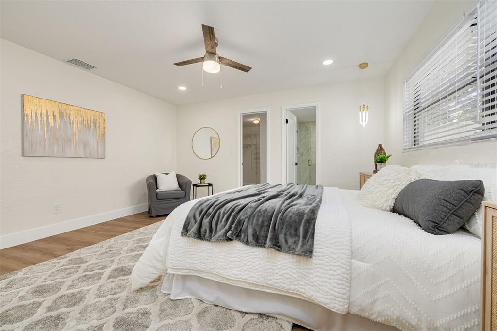 2034 58th Way North Clearwater, FL 33760 - Photo 20 of 35 a bedroom with a bed and ceiling fan