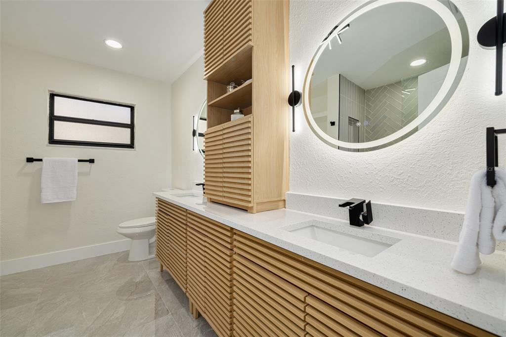 2034 58th Way North Clearwater, FL 33760 - Photo 26 of 35 a bathroom with a sink and a mirror