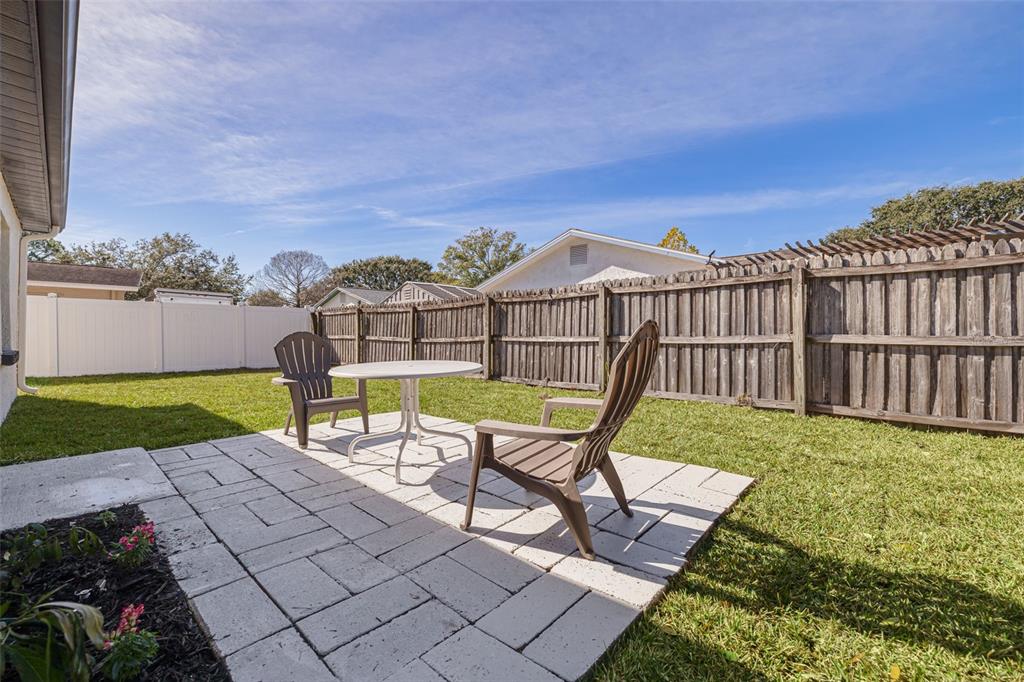 2034 58th Way North Clearwater, FL 33760 - Photo 33 of 35 a view of a chair and table on the terrace