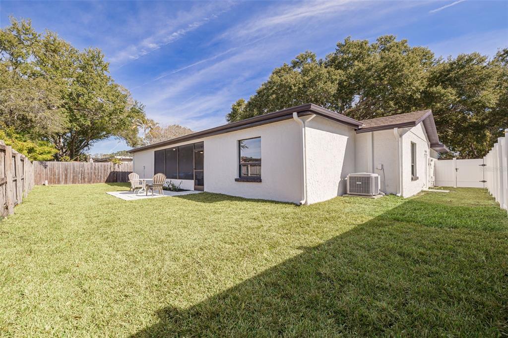 2034 58th Way North Clearwater, FL 33760 - Photo 35 of 35 a white house that has tree in front of it