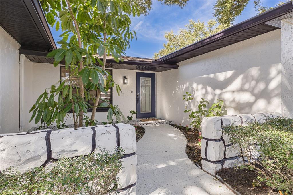 2034 58th Way North Clearwater, FL 33760 - Photo 4 of 35 a vase of flowers sitting on a floor