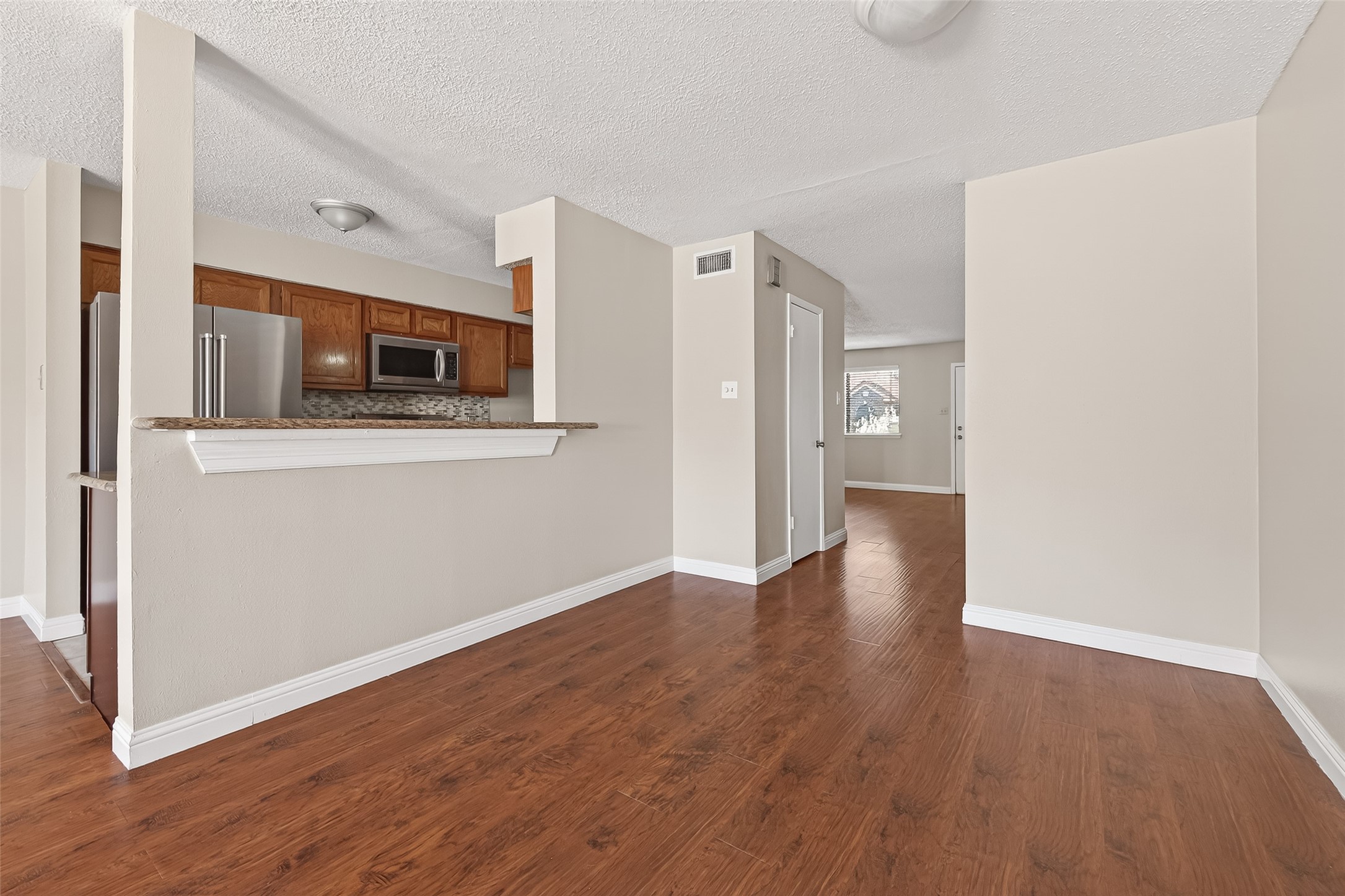 6424 Kentwick Drive, Unit 24/3 Houston, TX 77084 - Photo 15 of 48 a view of kitchen with stainless steel appliances wooden floor