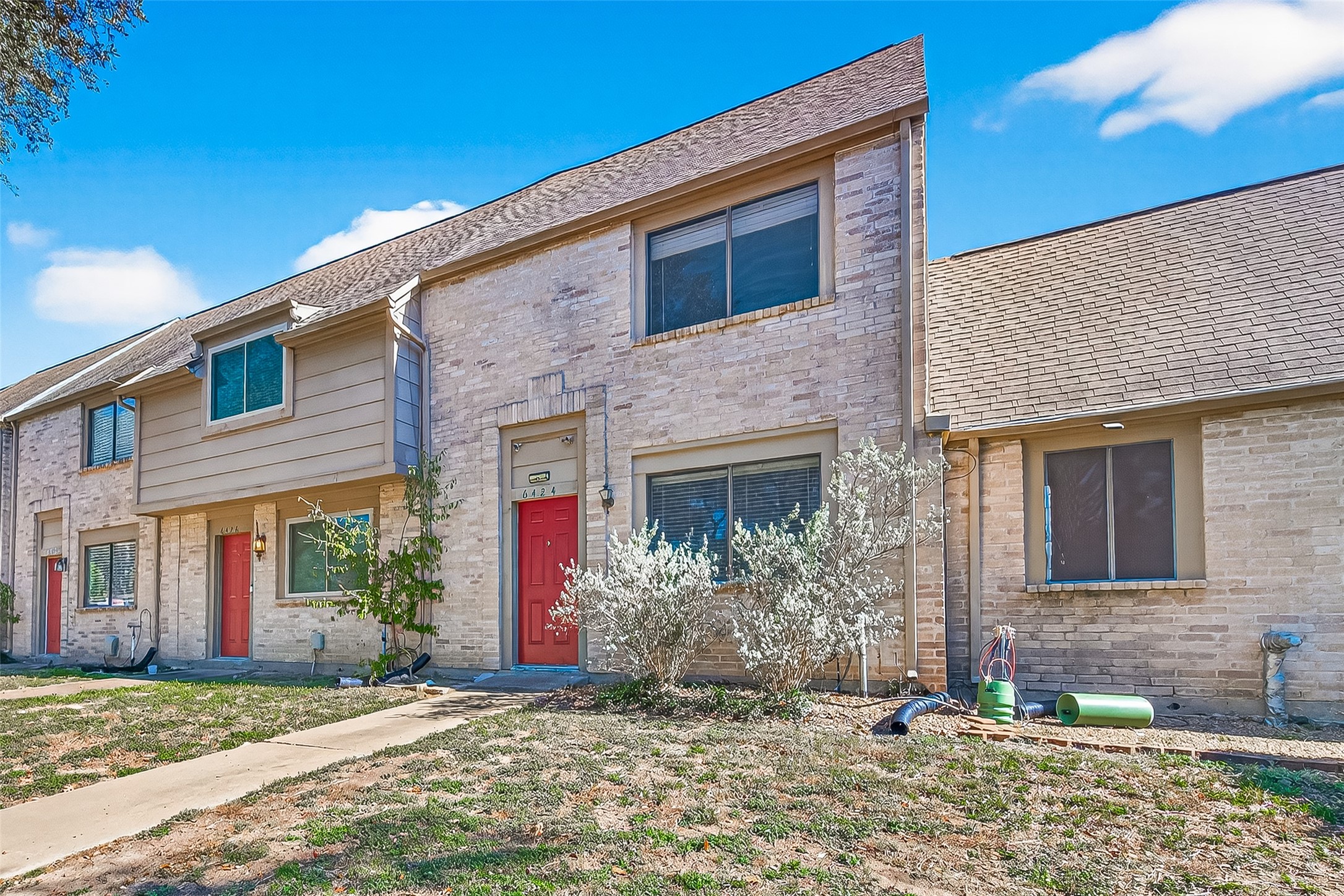 6424 Kentwick Drive, Unit 24/3 Houston, TX 77084 - Photo 5 of 48 a front view of a house with a yard