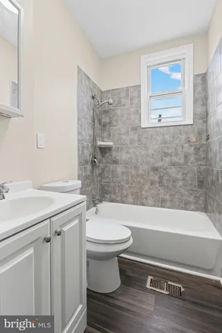 a kitchen with a refrigerator and a stove top oven