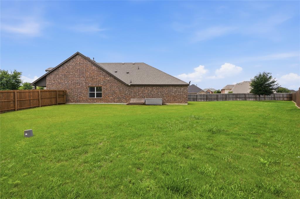 10101 Travis Road Little Elm, TX 75068 - Photo 26 of 26 a view of a house with a yard
