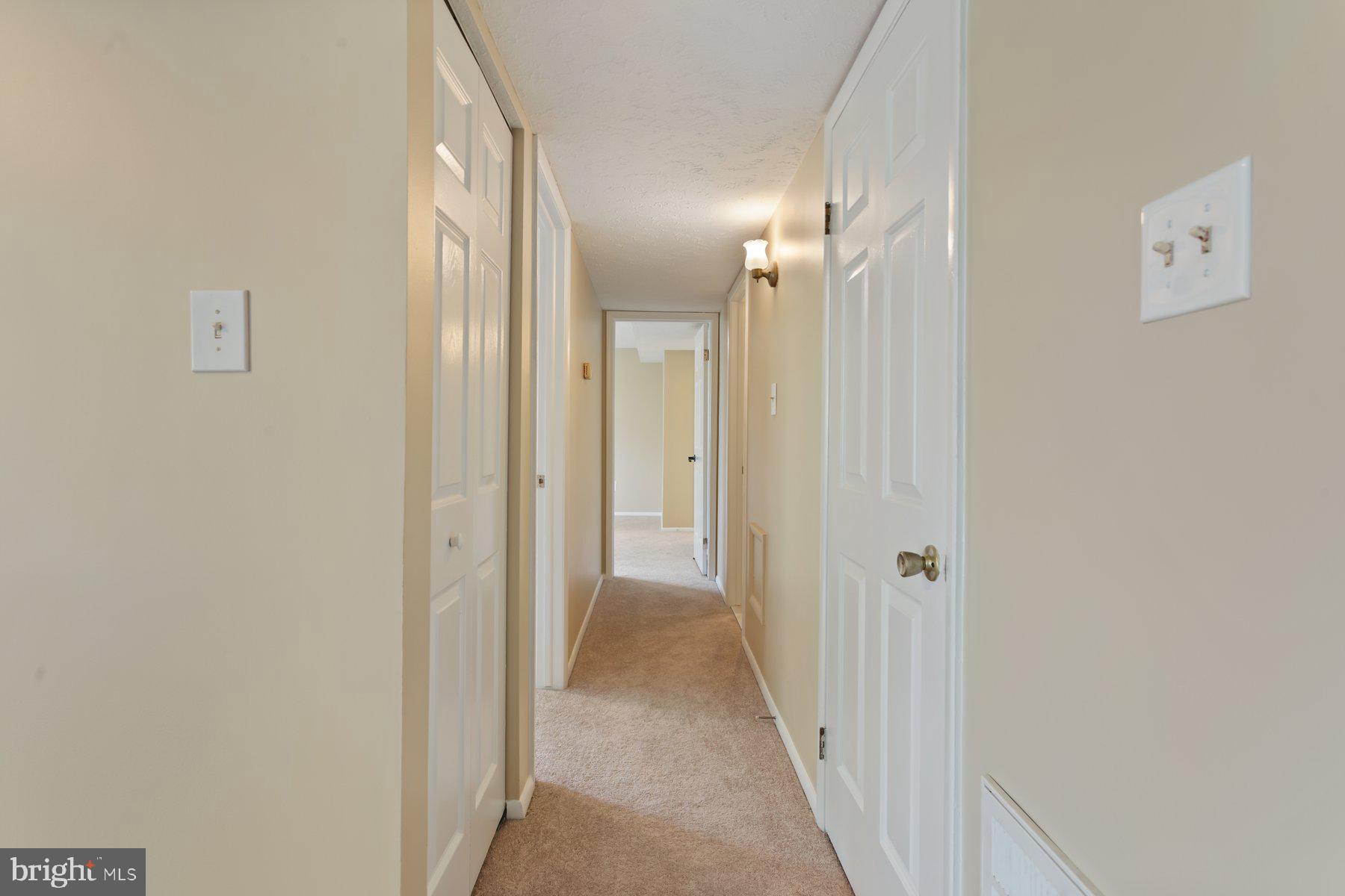 731 Heather Ridge Drive Frederick, MD 21702 - Photo 13 of 26 a view of a hallway with wooden floor