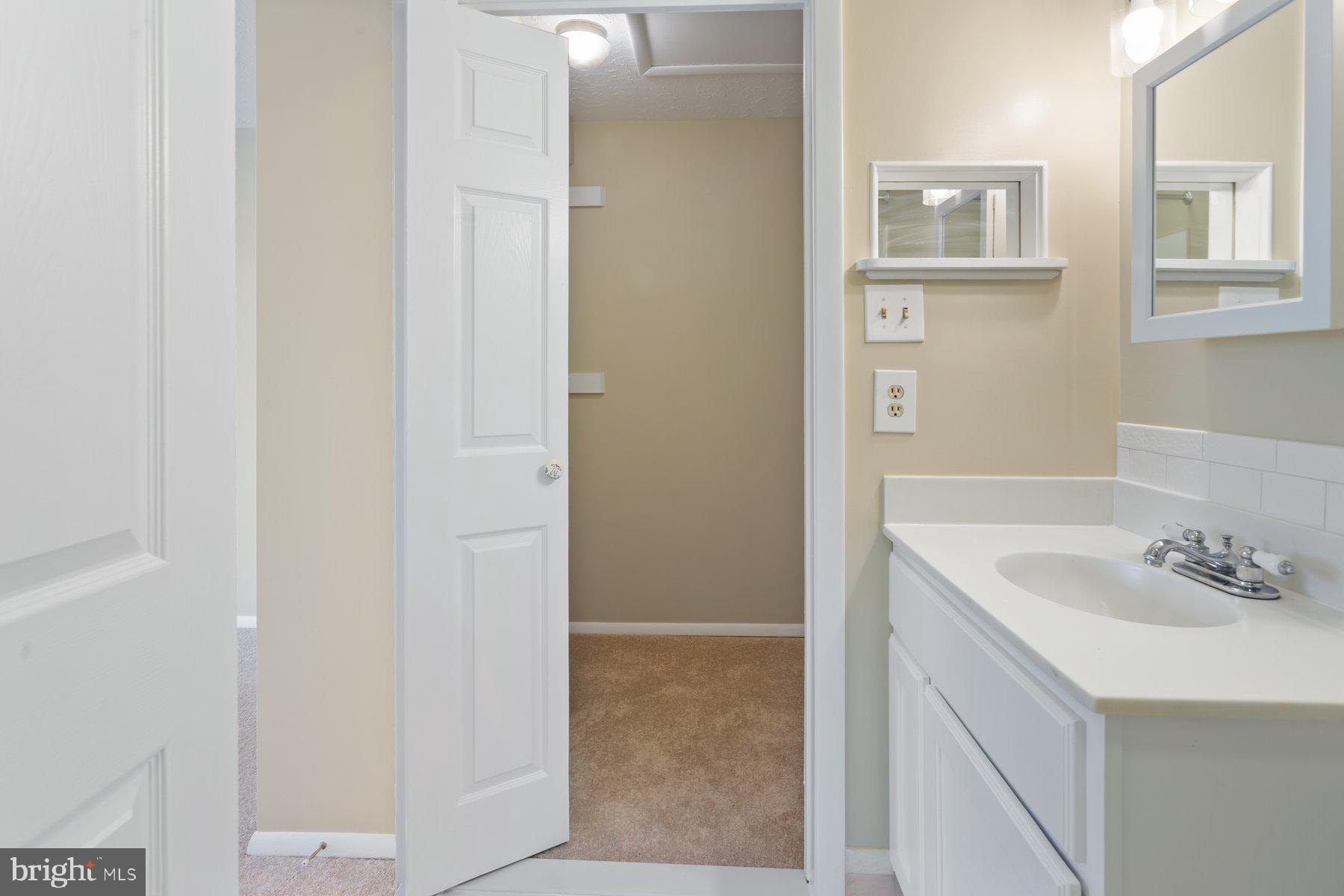 731 Heather Ridge Drive Frederick, MD 21702 - Photo 20 of 26 a bathroom with a sink and a mirror
