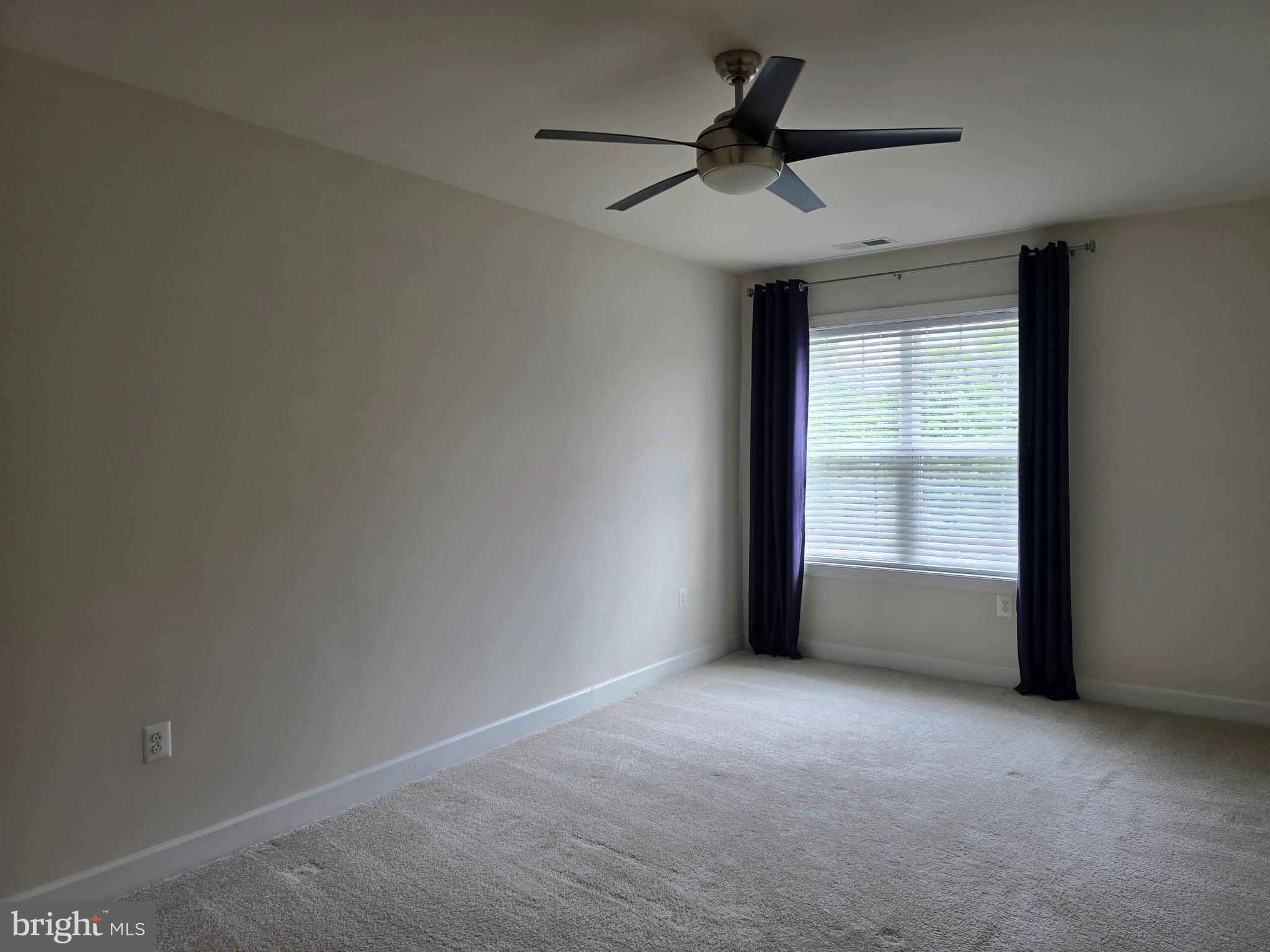 10530 Resort Road, Unit 101 Ellicott City, MD 21042 - Photo 8 of 13 a view of an empty room with a window