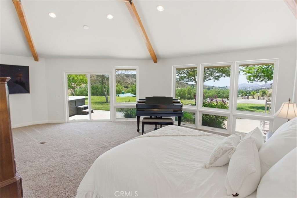 31233 Romero Canyon Road Castaic, CA 91384 - Photo 29 of 38 a bedroom with furniture and a large window