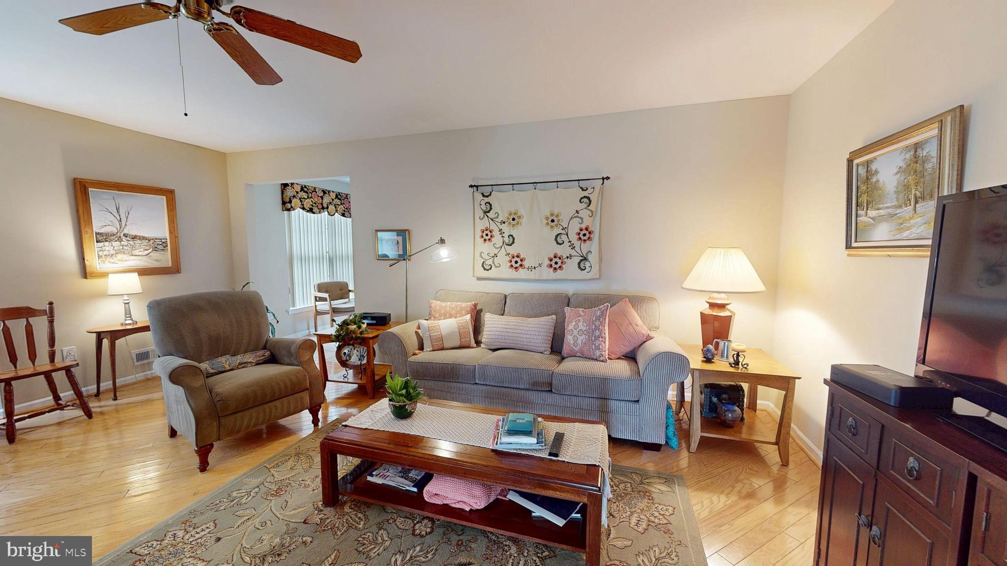 15 Carriage Berlin, NJ 08009 - Photo 15 of 61 a living room with furniture and a lamp