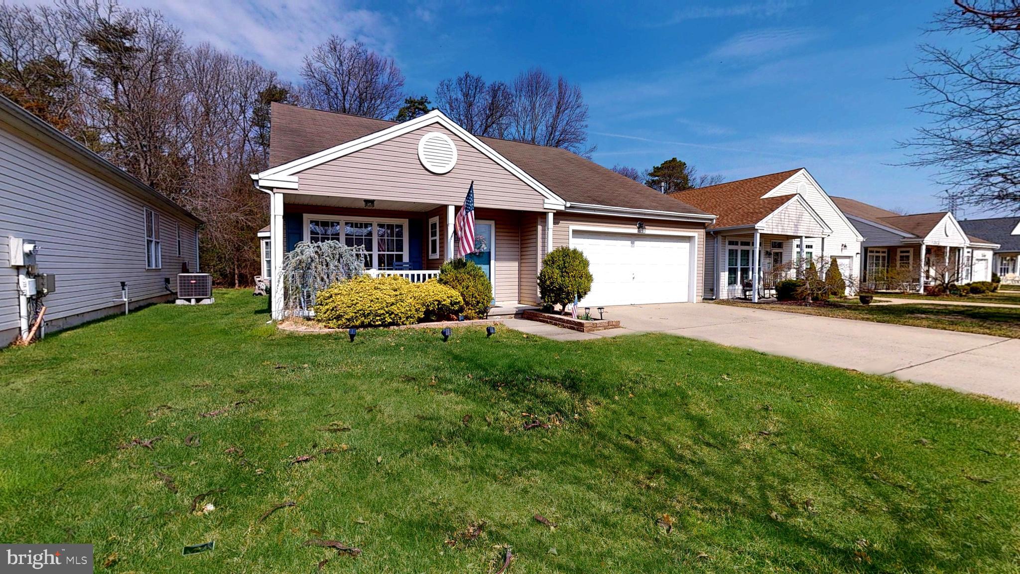 15 Carriage Berlin, NJ 08009 - Photo 2 of 61 a front view of a house with a yard and green space