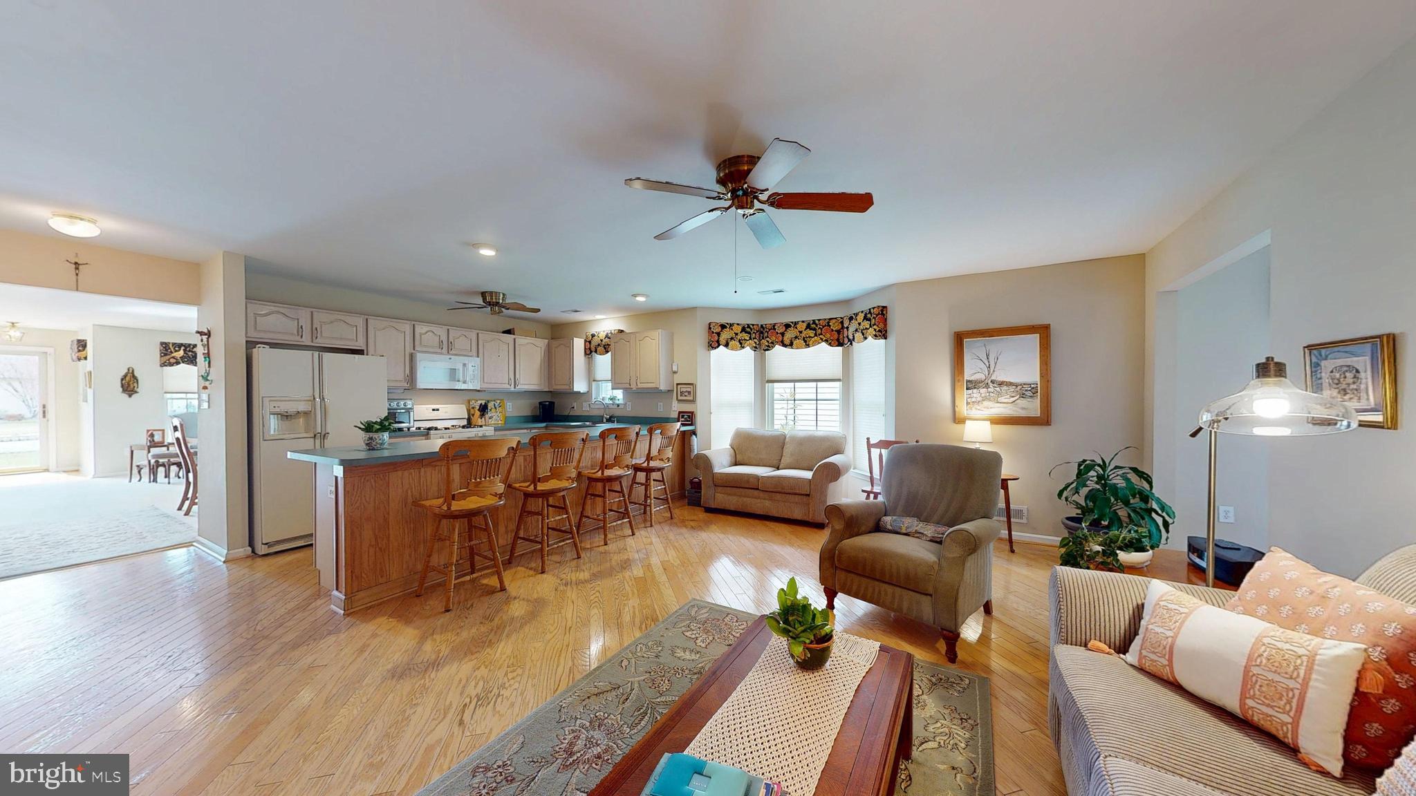 15 Carriage Berlin, NJ 08009 - Photo 21 of 61 a living room with furniture kitchen view and a wooden floor