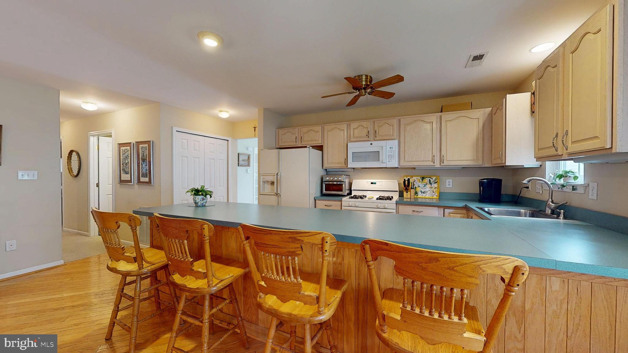 15 Carriage Berlin, NJ 08009 - Photo 22 of 61 a large kitchen with stainless steel appliances granite countertop a granite counter tops and a view of living room