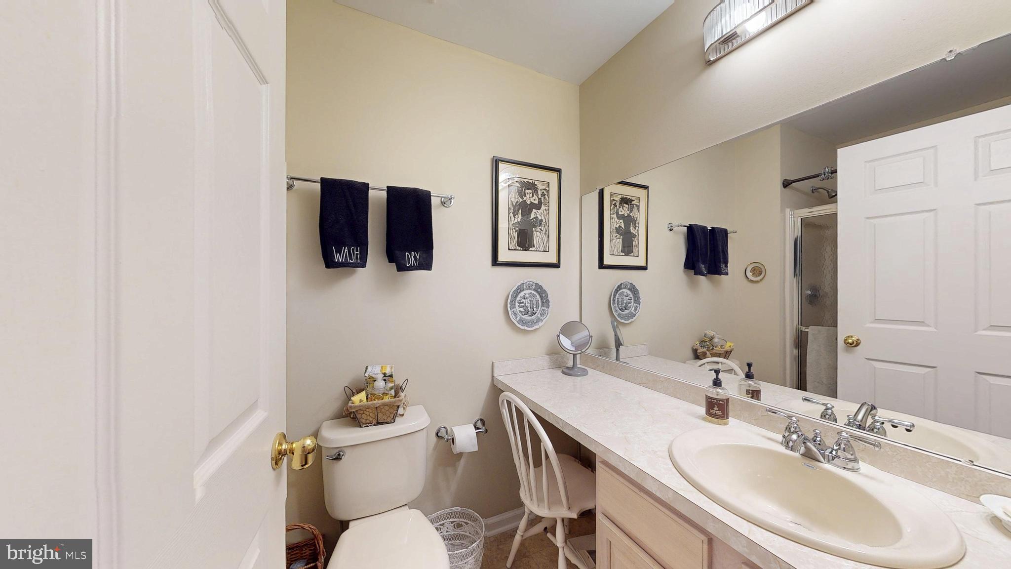 15 Carriage Berlin, NJ 08009 - Photo 34 of 61 a bathroom with a sink mirror and toilet