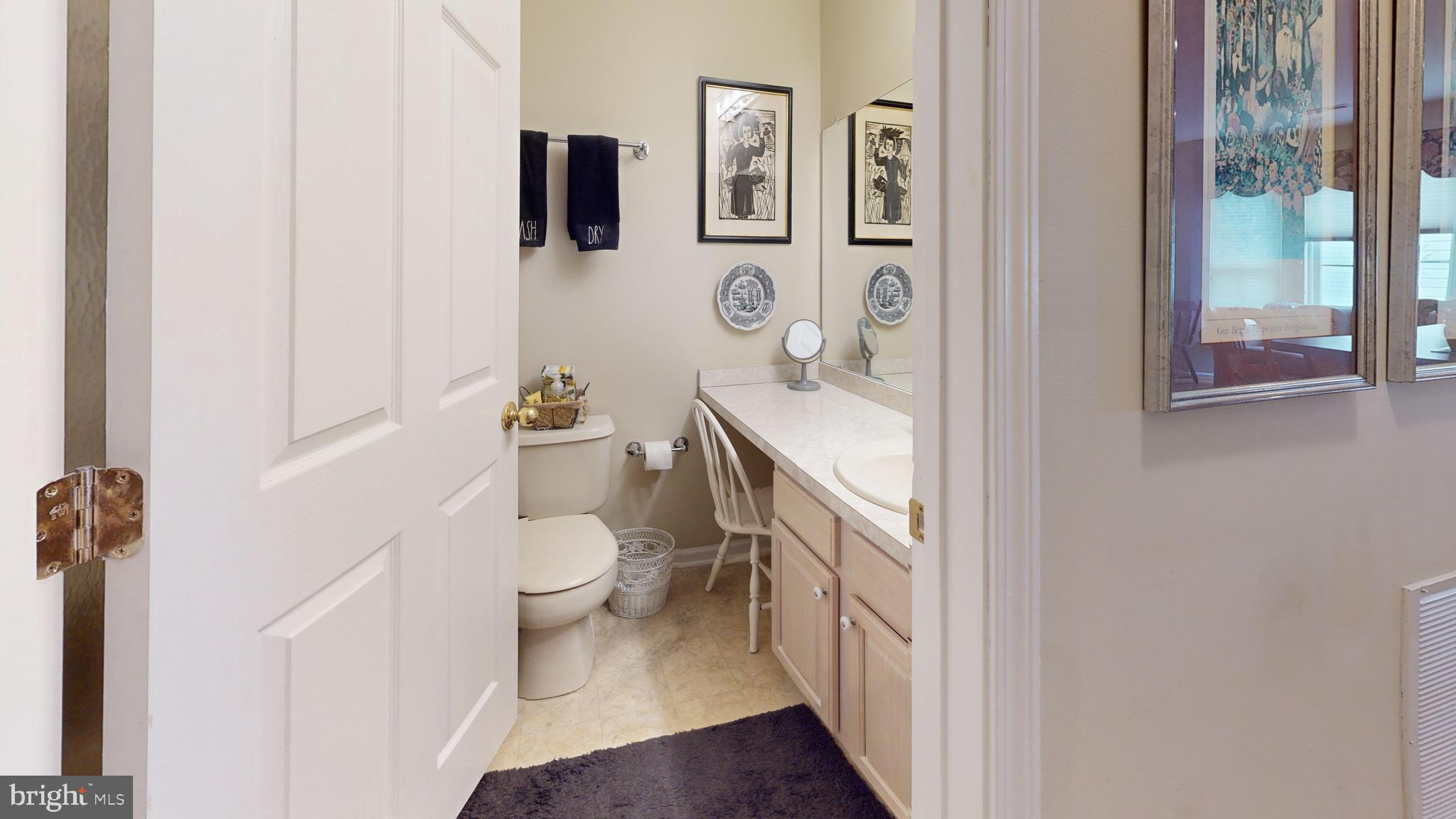 15 Carriage Berlin, NJ 08009 - Photo 35 of 61 a bathroom with a sink a toilet and a mirror