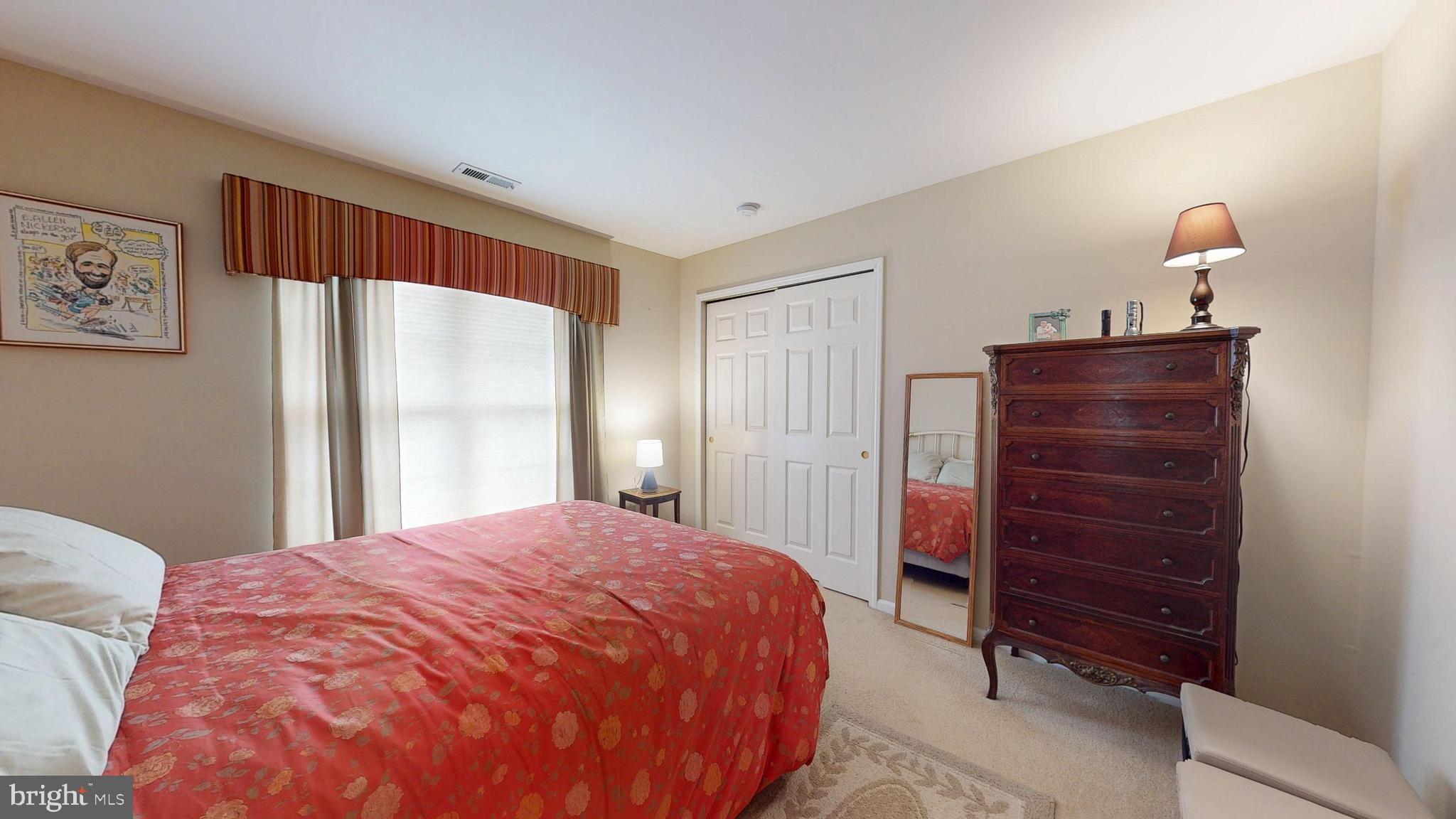 15 Carriage Berlin, NJ 08009 - Photo 37 of 61 a bedroom with a bed and a closet