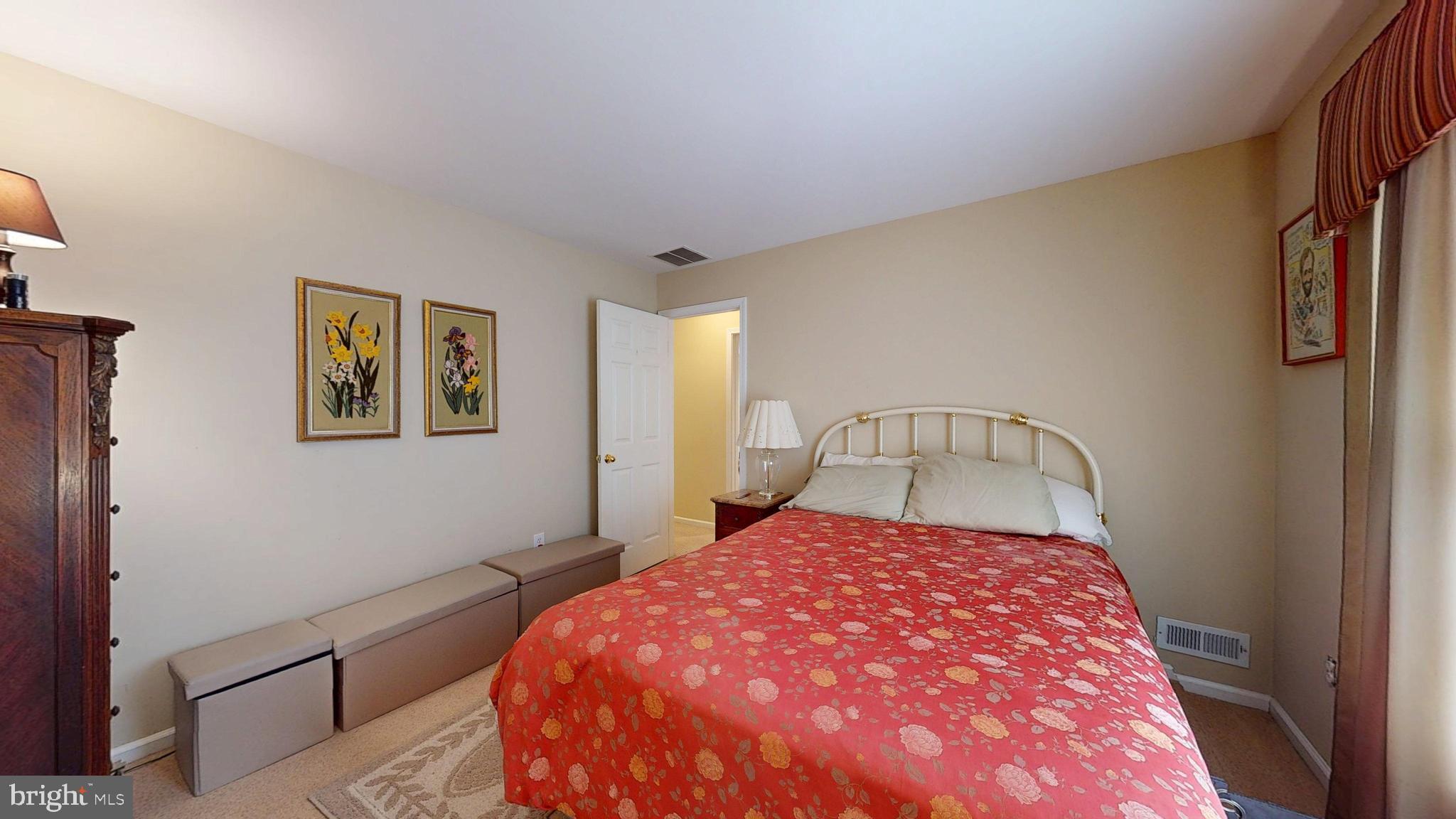 15 Carriage Berlin, NJ 08009 - Photo 39 of 61 a bedroom with a bed and a view of kitchen