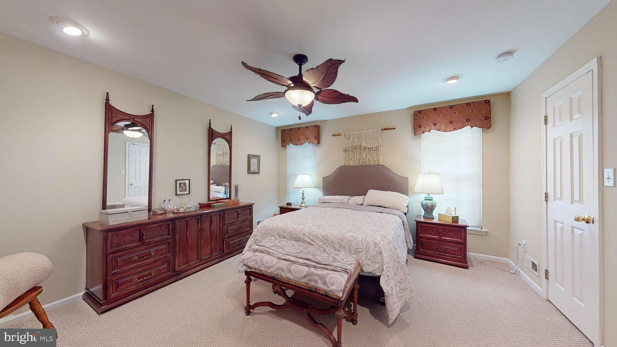 15 Carriage Berlin, NJ 08009 - Photo 40 of 61 a bedroom with a bed dresser and a window