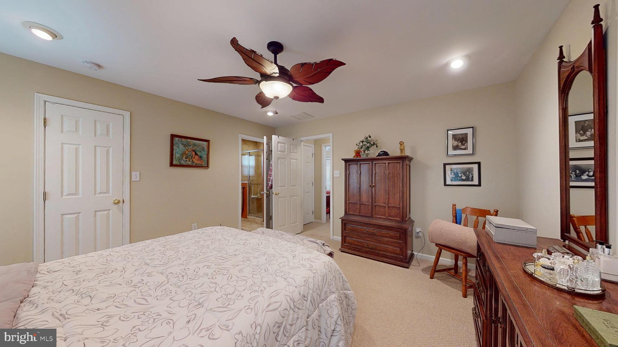 15 Carriage Berlin, NJ 08009 - Photo 42 of 61 a bedroom with a bed and a dresser in it
