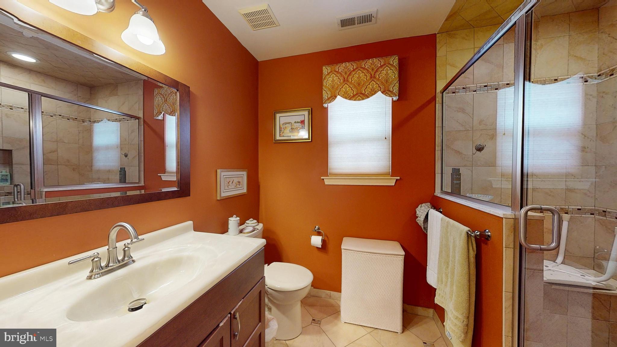 15 Carriage Berlin, NJ 08009 - Photo 45 of 61 a bathroom with a sink mirror vanity and toilet