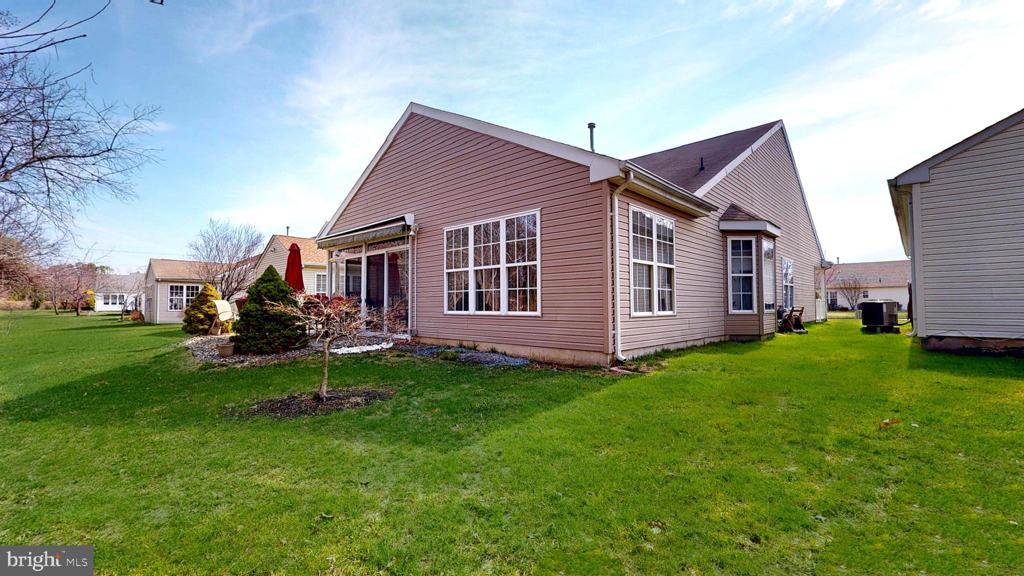 15 Carriage Berlin, NJ 08009 - Photo 52 of 61 a view of a house with a backyard and sitting area