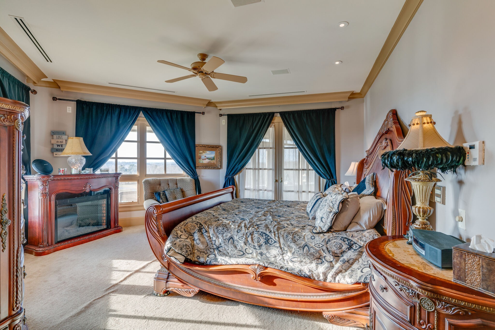 6300 Cairo Bend Road Lebanon, TN 37087 - Photo 18 of 50 a living room with furniture a fireplace and a flat screen tv