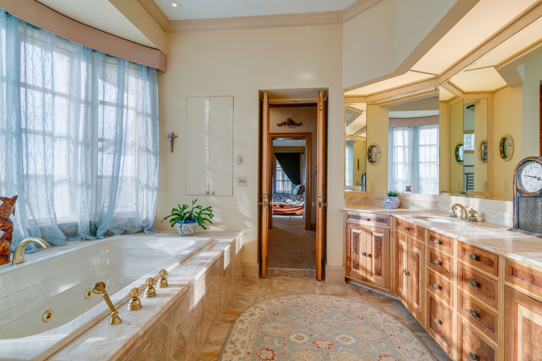 6300 Cairo Bend Road Lebanon, TN 37087 - Photo 22 of 50 a spacious bathroom with a granite countertop tub sink and mirror