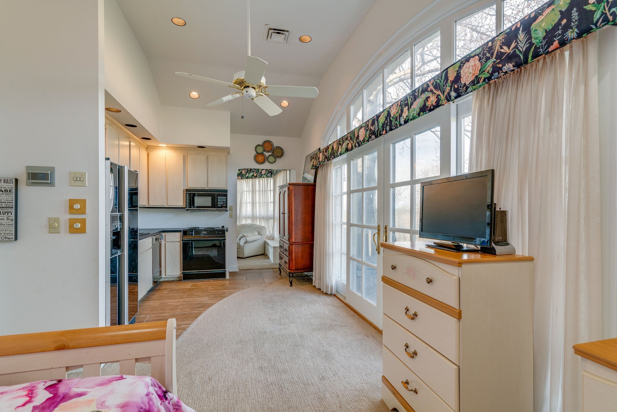 6300 Cairo Bend Road Lebanon, TN 37087 - Photo 32 of 50 a living room with stainless steel appliances furniture and a flat screen tv