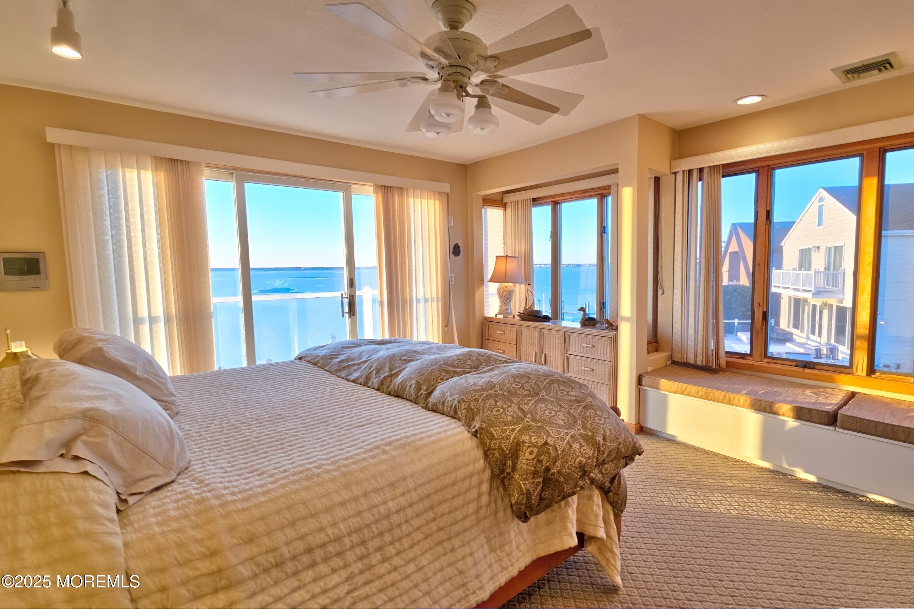 495 Boca Raton Drive Lavallette, NJ 08735 - Photo 32 of 48 a bedroom with a large bed and a large window