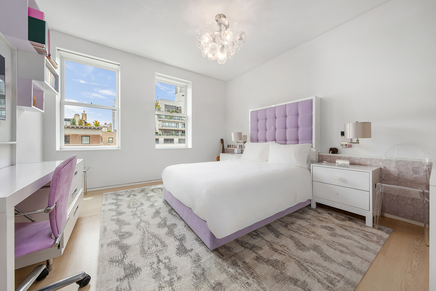 812 Park Avenue, Unit PHA Manhattan, NY 10021 - Photo 10 of 14 a room with a large bed and a couch