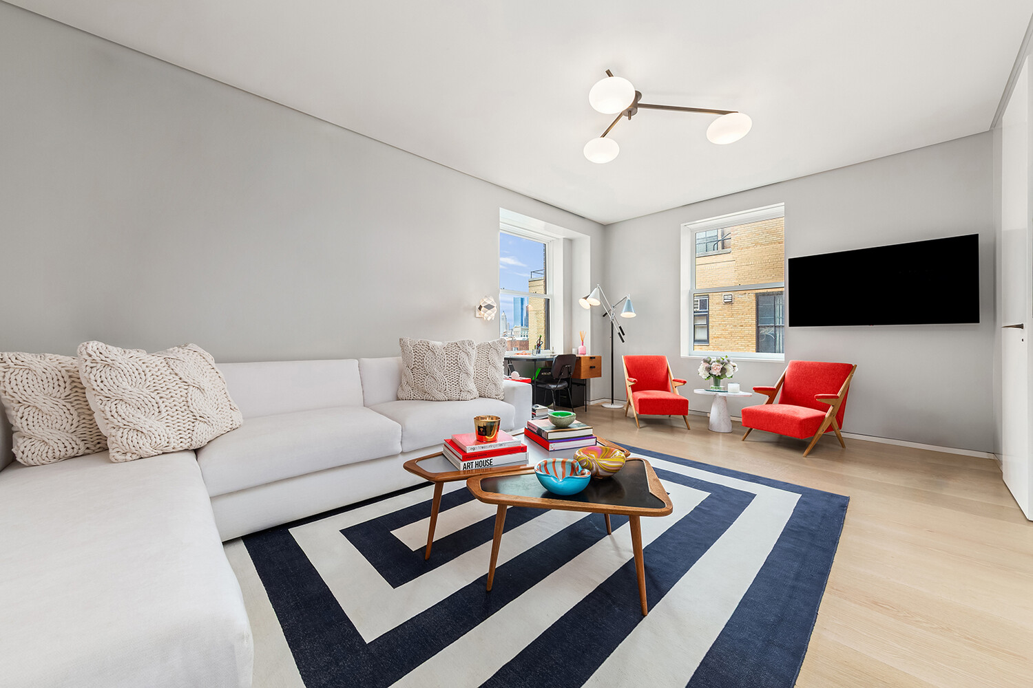 812 Park Avenue, Unit PHA Manhattan, NY 10021 - Photo 12 of 14 a living room with furniture and a flat screen tv