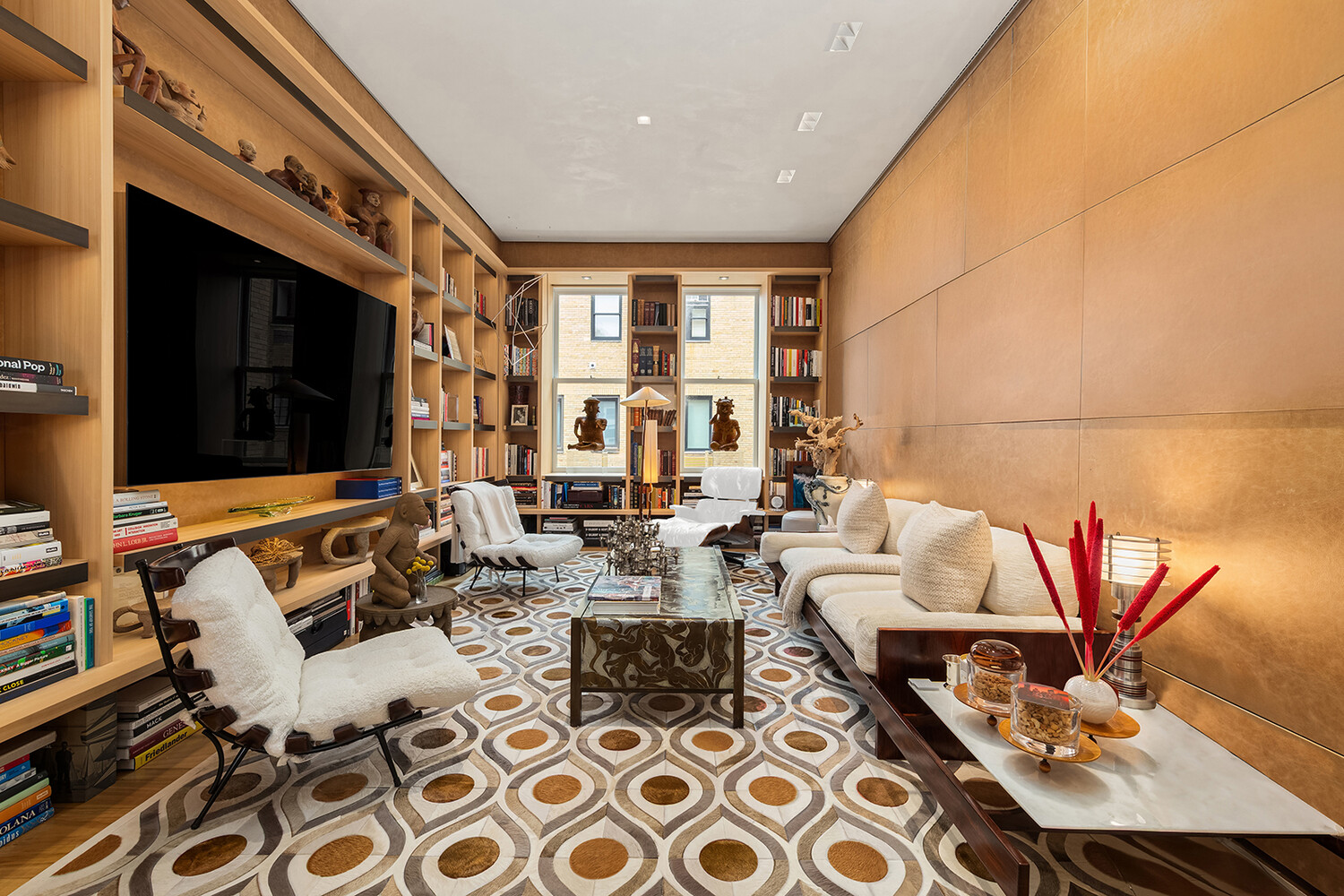 812 Park Avenue, Unit PHA Manhattan, NY 10021 - Photo 5 of 14 a living room with furniture and a flat screen tv