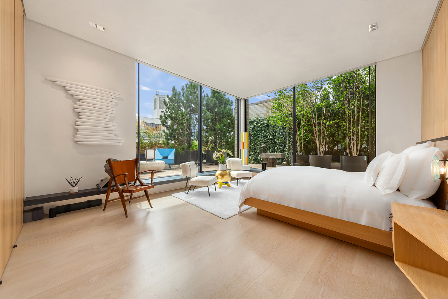 812 Park Avenue, Unit PHA Manhattan, NY 10021 - Photo 7 of 14 a bedroom with furniture and large windows