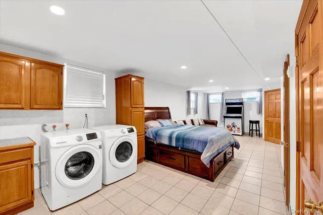 a bed room with a bed and washer
