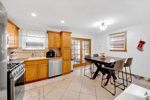a view of a dining room with furniture and a window