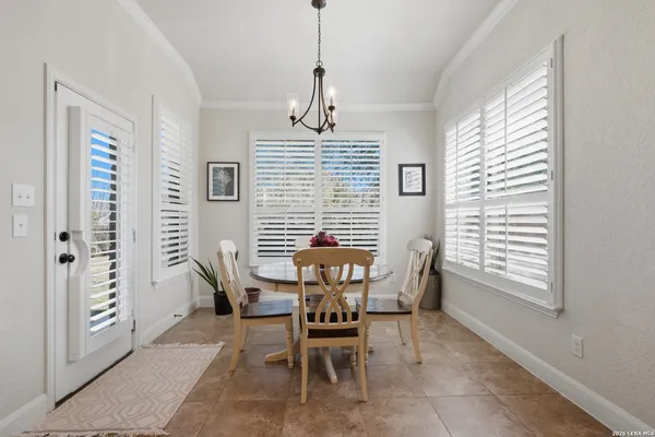 a dining room with furniture and window