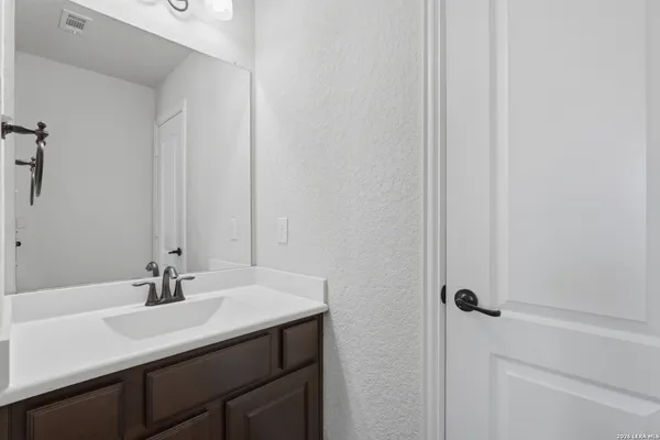 a room with refrigerator and washer