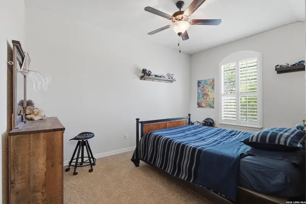 a bathroom with a granite countertop sink mirror and shower
