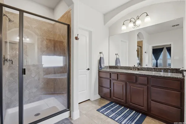 a bathroom with a tub and a sink