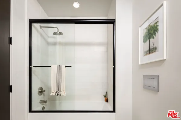 a picture of a bathroom with a glass shower door