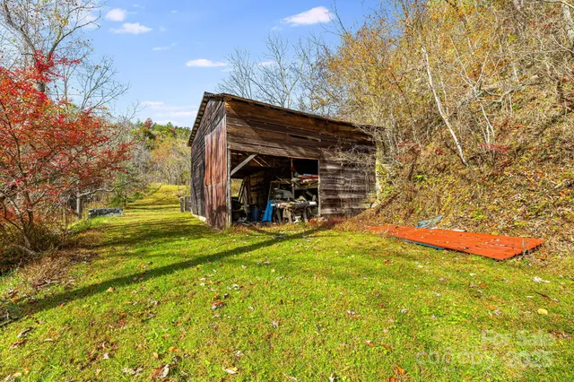a bedroom with furniture and a book shelf