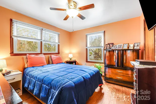 a utility room with dryer washer and a flat screen tv
