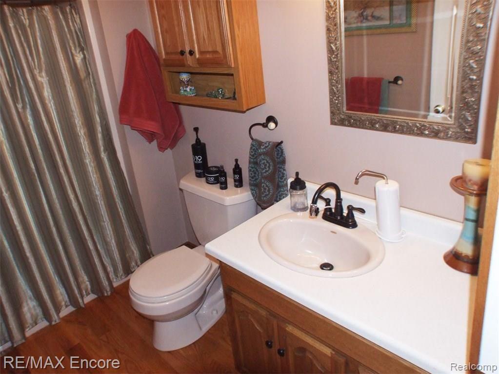 3409 Wynns Mill Road Metamora, MI 48455 - Photo 17 of 31 Guest bath on main floor with hardwood floor