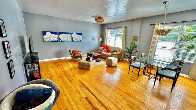 a kitchen with a stove a sink and a microwave