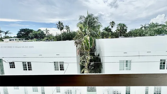 a bedroom with a bed couch and a window