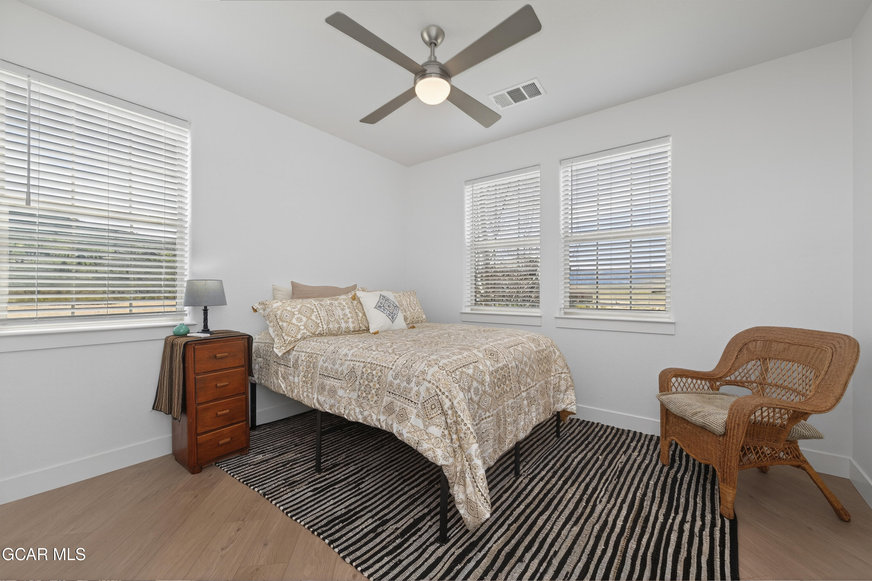 160 Village Road, Unit F207 Granby, CO 80446 - Photo 12 of 28 a bedroom with a bed and a window