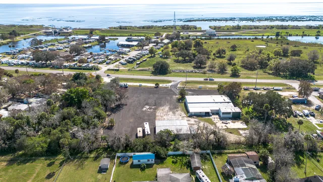 a view of a workspace with furniture and wooden floor