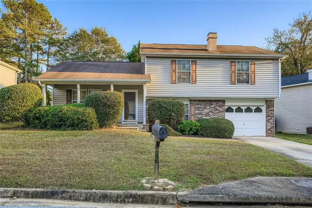 a front view of a house with garden